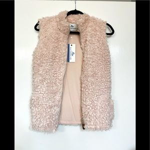 Light pink southbound vest, zips in front.